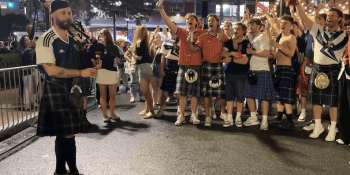 Scotland bagpiper and fans in Boston