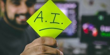Man holding an AI sign