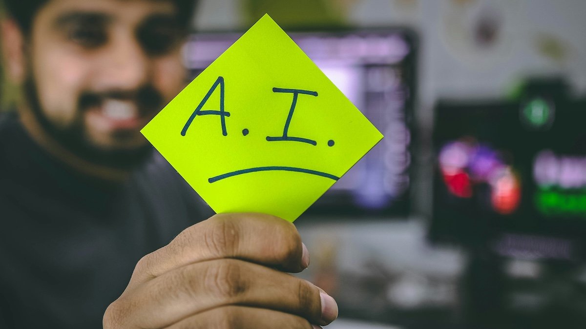 Man holding an AI sign