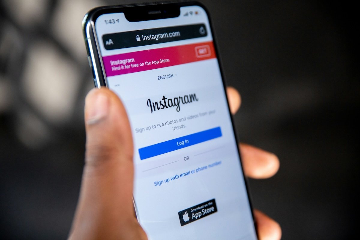 mobile phone in hand displaying instagram