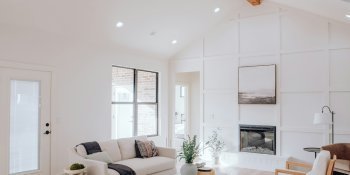 a living room with a couch a chair and a fireplace