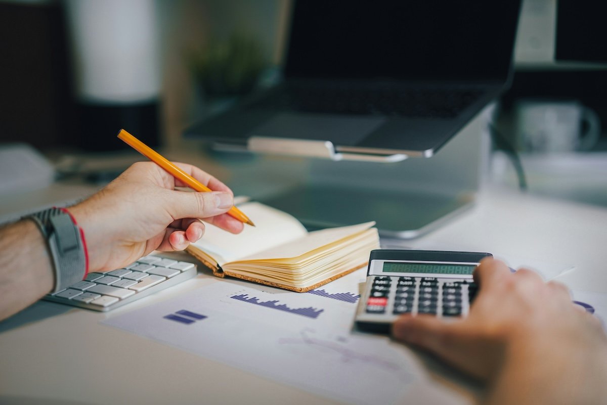 calculator and writing in notebook