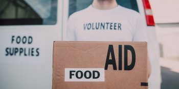 aid worker carrying box